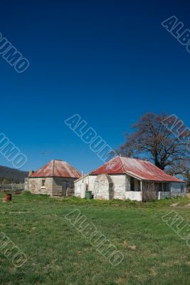 Dilapidated Farm House and Tree