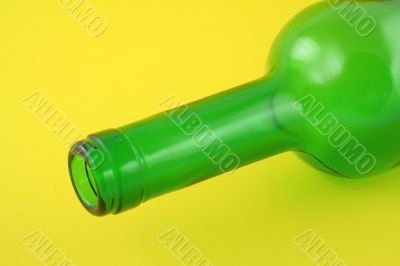 wine bottleneck on yellow