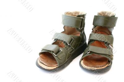 children`s orthopaedic sandals on white background