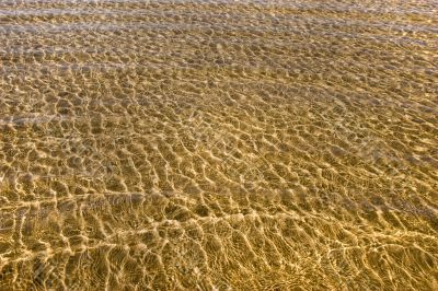 ripples on gold ocean