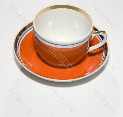 red cup with saucer