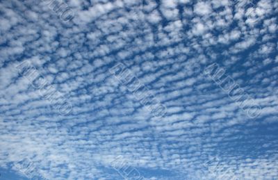 Panorama of blue white cloudy sky wide angle view