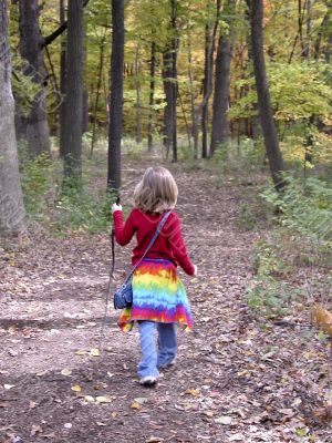 girl walking in woods