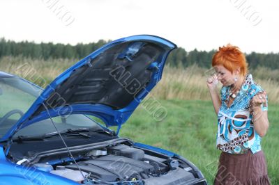 young woman with her broken car