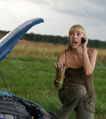 young woman with her broken car