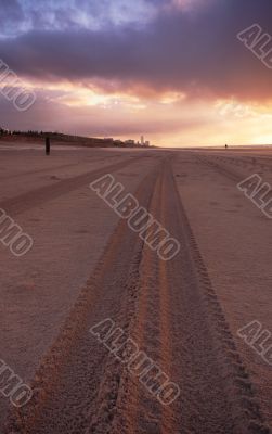 tire tracks on the beach