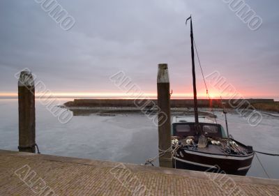 harbor and boat on a cold day in winter