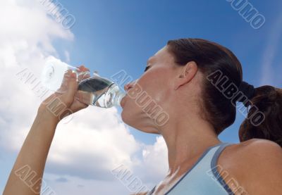 woman drinking after workout