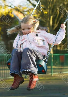 cute girl on  swing
