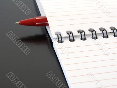 notepad with pen
