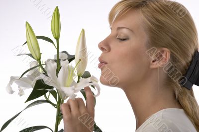 beautiful girl smelling madonna lily