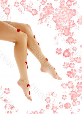 beautiful legs with flowers in spa