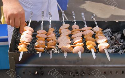 Slices of sausages on skewers