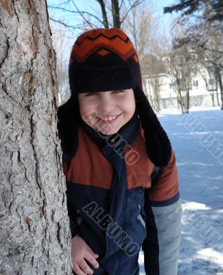 boy near a tree.