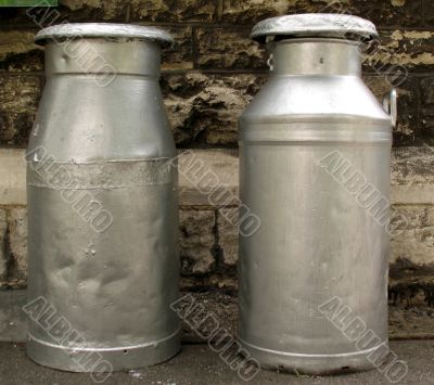 Two old milk churns