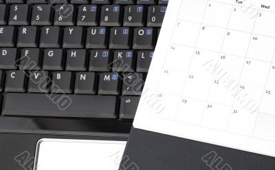 Black Laptop And Calendar