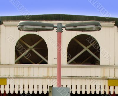 twin lamp post against building frontage