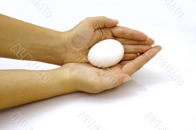 Hands holding an egg
