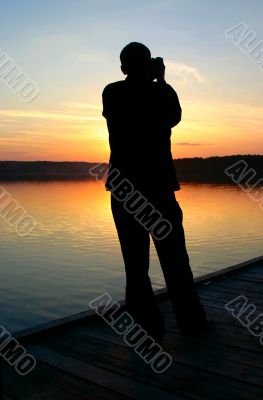 photographer capturing sunset