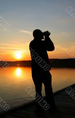 photographer capturing sunset