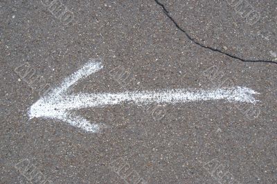 Arrow on asphalt