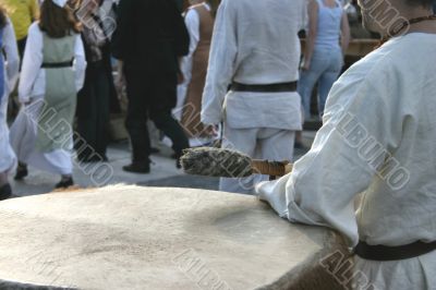man playing a giant drum