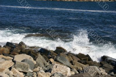 Breaking waves on granite ledges