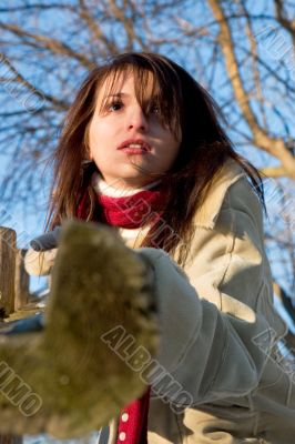 Leaning on a wooden post