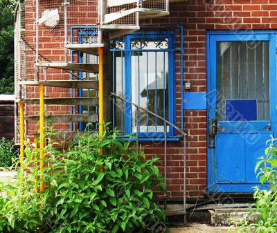back door and spiral stairs