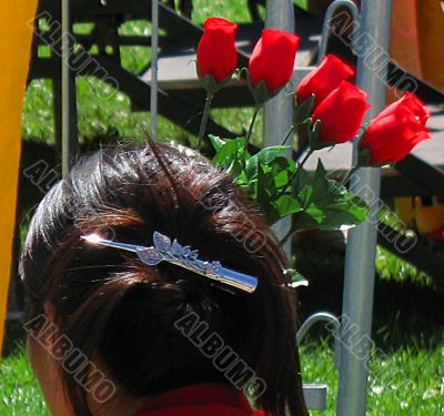lady with hair clasp and  roses