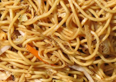A squiggle of noodles with a little carrot