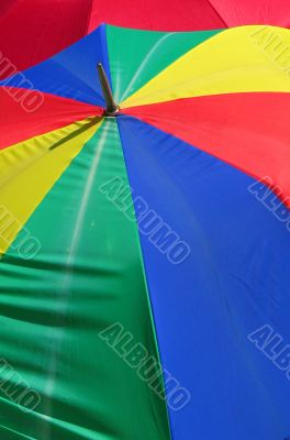 coloured umbrella against red umbrella