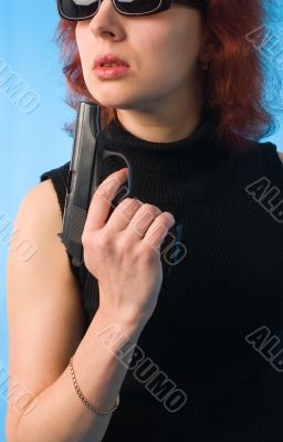 redhaired woman with pistol