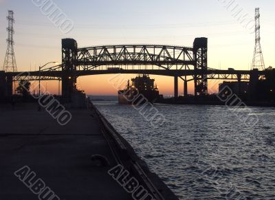 Ship Passes Under Lift Bridge