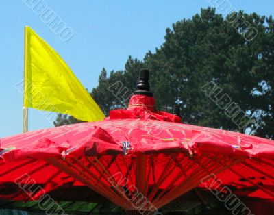 red parasol yellow flag
