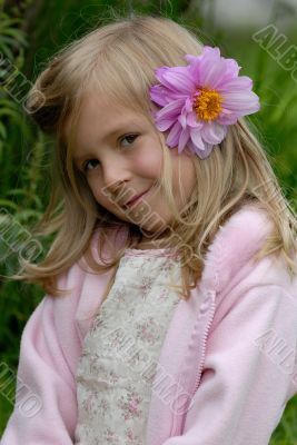 the little girl with a flower in hair