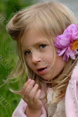 the little girl with a flower in hair