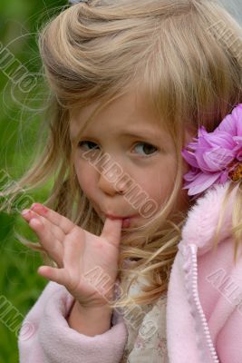 the little girl with a flower in hair