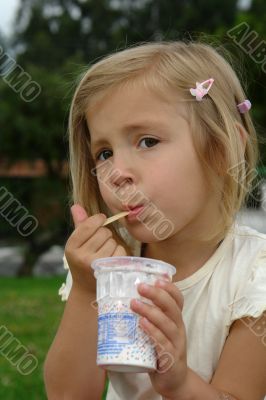 the girl eats ice-cream
