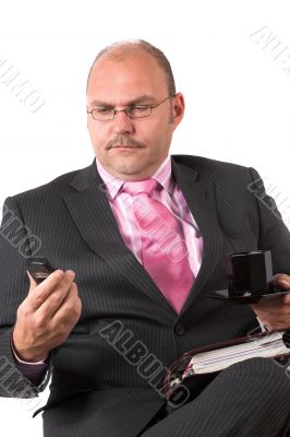 Businessman checking out the display on his phone