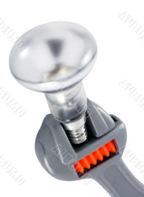 electric bulb and wrench on a white background