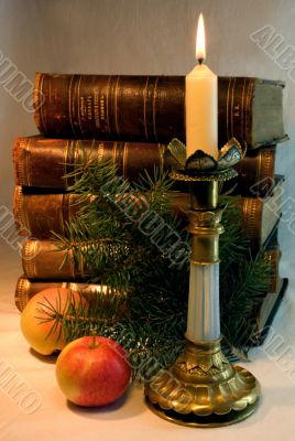 The Christmas candle and old books.