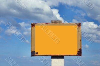 rusty sign post against the sky