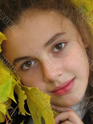 The portrait of girl in an autumn