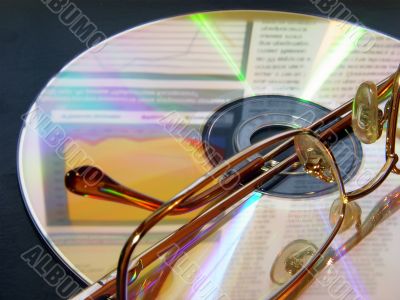 glasses laying on the CD