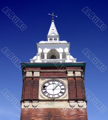 clock tower against blue sky