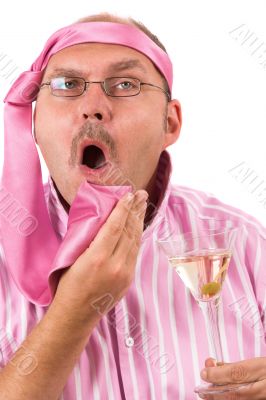 Businessman wiping his mouth with his tie