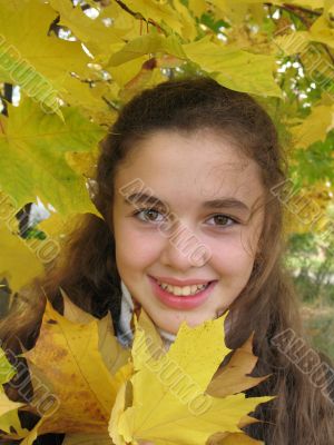 Smile girl with yellow leaves