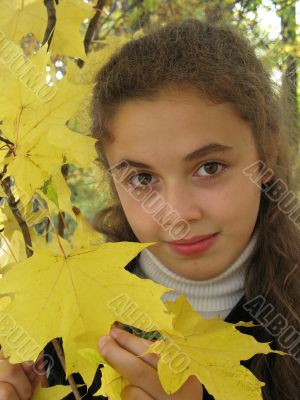 The girl with yellow leaves