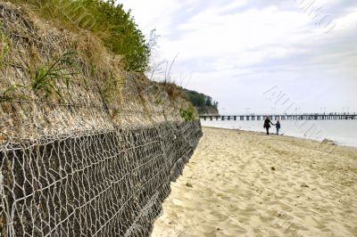 breakwater, pier in background